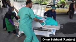 FILE: A wounded victim being carried into a hospital in Kabul on July 25. 