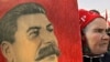 Russia - A woman carries the portrait of Josef Stalin during the pro-Communist demonstration in Moscow, 01May2007