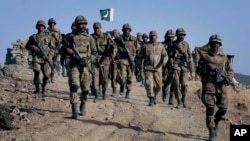 Pakistani troops patrol near the Afghan border. (file photo)