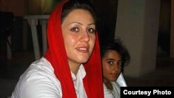 Iranian rights activist Maryam Akbari Monfared is pictured with one of her daughters in this undated photo.