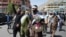 Afghan peace activists shout slogans to demand an end to the war as they arrived in Kabul on June 18.