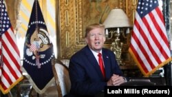 FILE: U.S. President Donald Trump speaks to the media after participating in a video teleconference with members of the U.S. military at Trump's Mar-a-Lago resort in Palm Beach, Florida on December 24 2019.