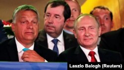 Russian President Vladimir Putin (front right) and Hungarian Prime Minister Viktor Orban (left) attend the Suzuki World Judo Championship in Budapest, Hungary, on August 28.