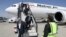 Passengers disembark an Iranian Mahan Air flight at the airport in Kabul on September 15.