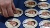 Pins bearing portraits of Sergei Magnitsky, for which the Magnitsky Act was named. 