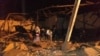 LIBYA -- Security and emergency personnel work at site of an airstrike at a detention centre for mainly African migrants, in a suburb of Tripoli, Libya, July 3, 2019, in this image obtained from social media. 