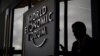 A participant to the to the World Economic Forum (WEF) annual meeting is seen in silhouette at the Congress Centre on January 21, 2019 in Davos, eastern Switzerland.