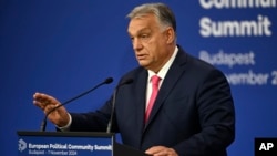 Hungarian Prime Minister Viktor Orban gestures at a press conference on November 7 ahead of the summit in Budapest. 