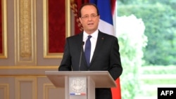 Francois Hollande delivers a speech at the Elysee Palace after being officially invested as French president.
