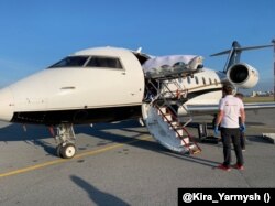 Aleksei Navalny is loaded onto an air ambulance in Omsk on August 22.