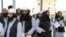 Newly freed Taliban prisoners are processed at Bagram prison, north of Kabul, on April 9.