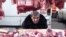 Georgia -- A vendor sells meat for the New Year meal on a street market in Tbilisi, 29Dec2009
