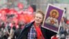 RUSSIA – Russian Communist party supporter carries a icon of Soviet dictator Joseph Stalin during the demonstration marking the Labor Day in Moscow, 01 May 2012