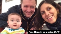 Nazanin Zaghari-Ratcliffe (right) poses with her husband, Richard, and daughter, Gabriella (undated).